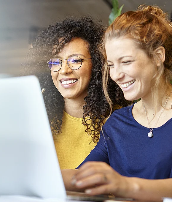 women employees at laptop