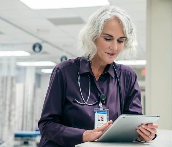 Image of nurse reviewing paperwork for patient