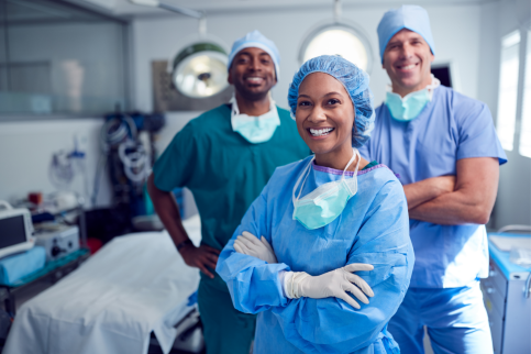 Anesthesiologists and surgeons in operating room