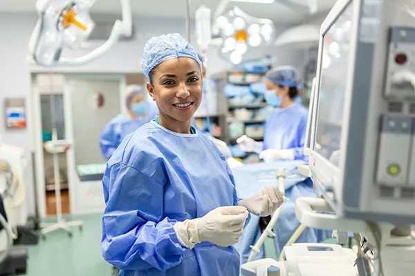 anesthesiologist checking monitors during surgery