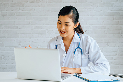 Hospitalist physician connecting with patients through virtual care.