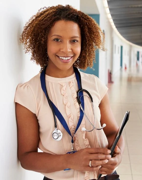 Young female physicians assistant holding tablet