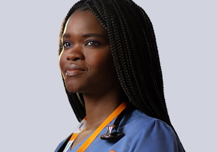 Female Vituity nurse smiling in blue scrubs