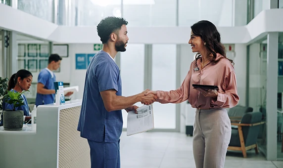 medical professionals shaking hands