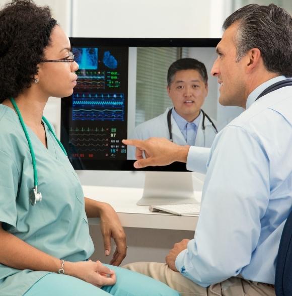 Doctors consulting over video about telestroke and teleneurology