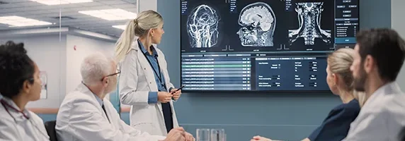 medical staff reviewing a patient's digital scans in conference room