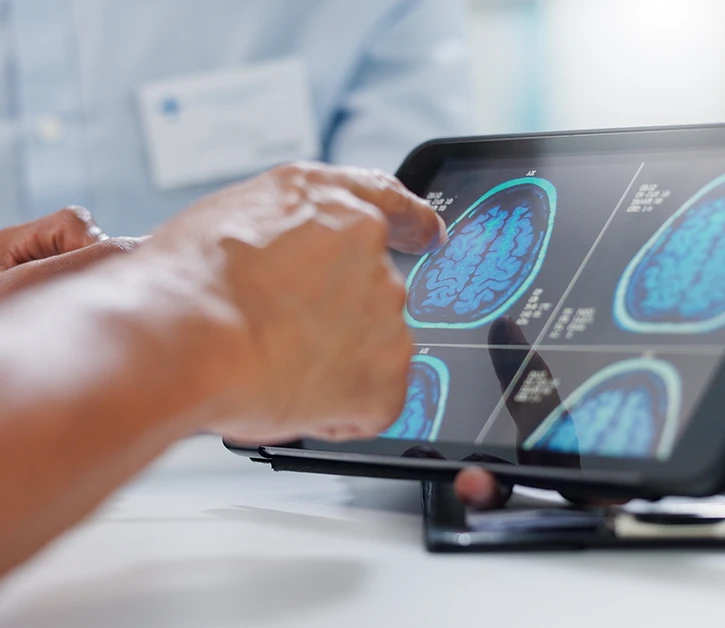 Doctor, hands and tablet with brain scan for patient, consultation or examination results at hospital 
