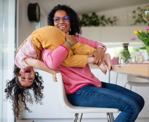 Image of Vituity employee playing with daughter